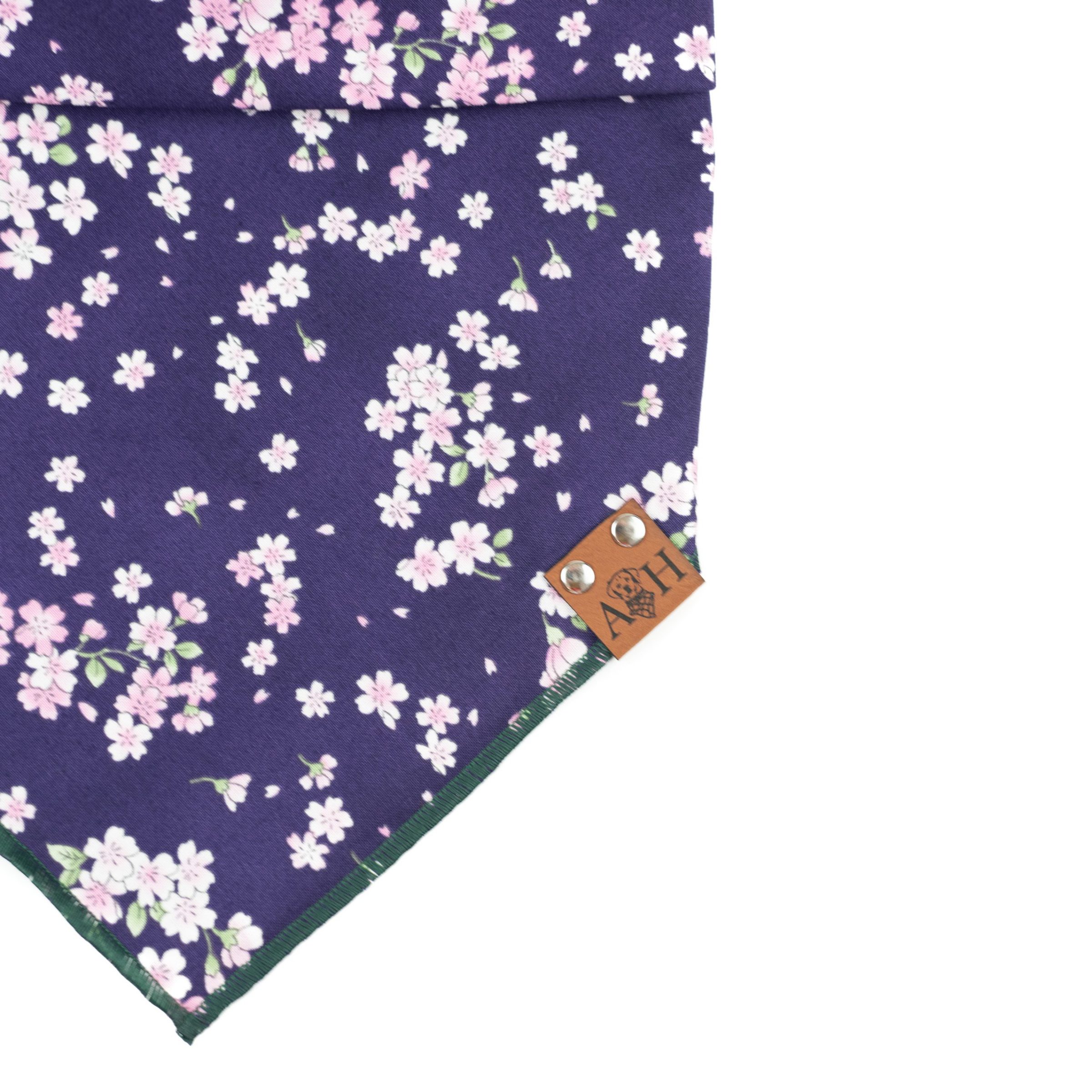 Thalia dog bandana with purple background and pink cherry blossoms
