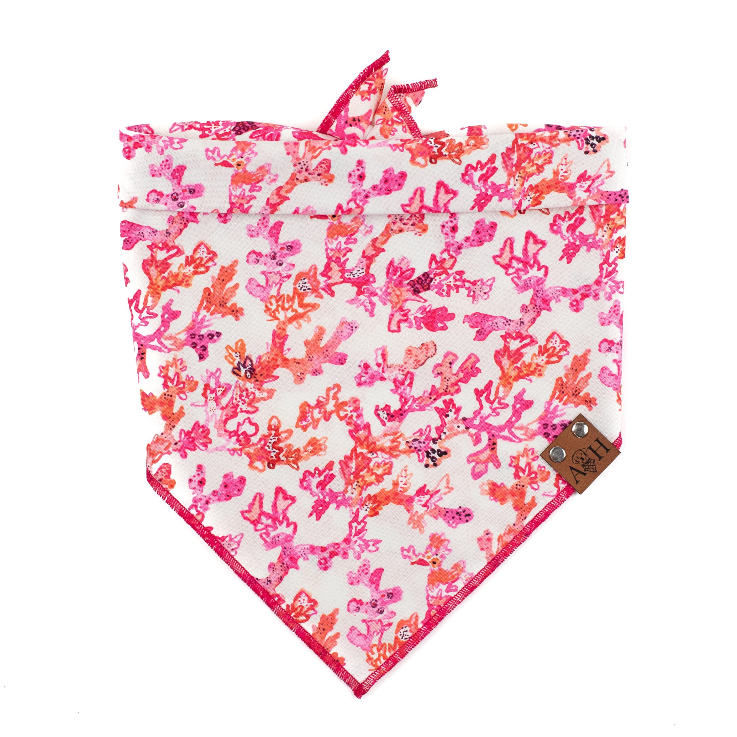Coral Reef Dog Bandana with a pink, red and orange coral reef pattern