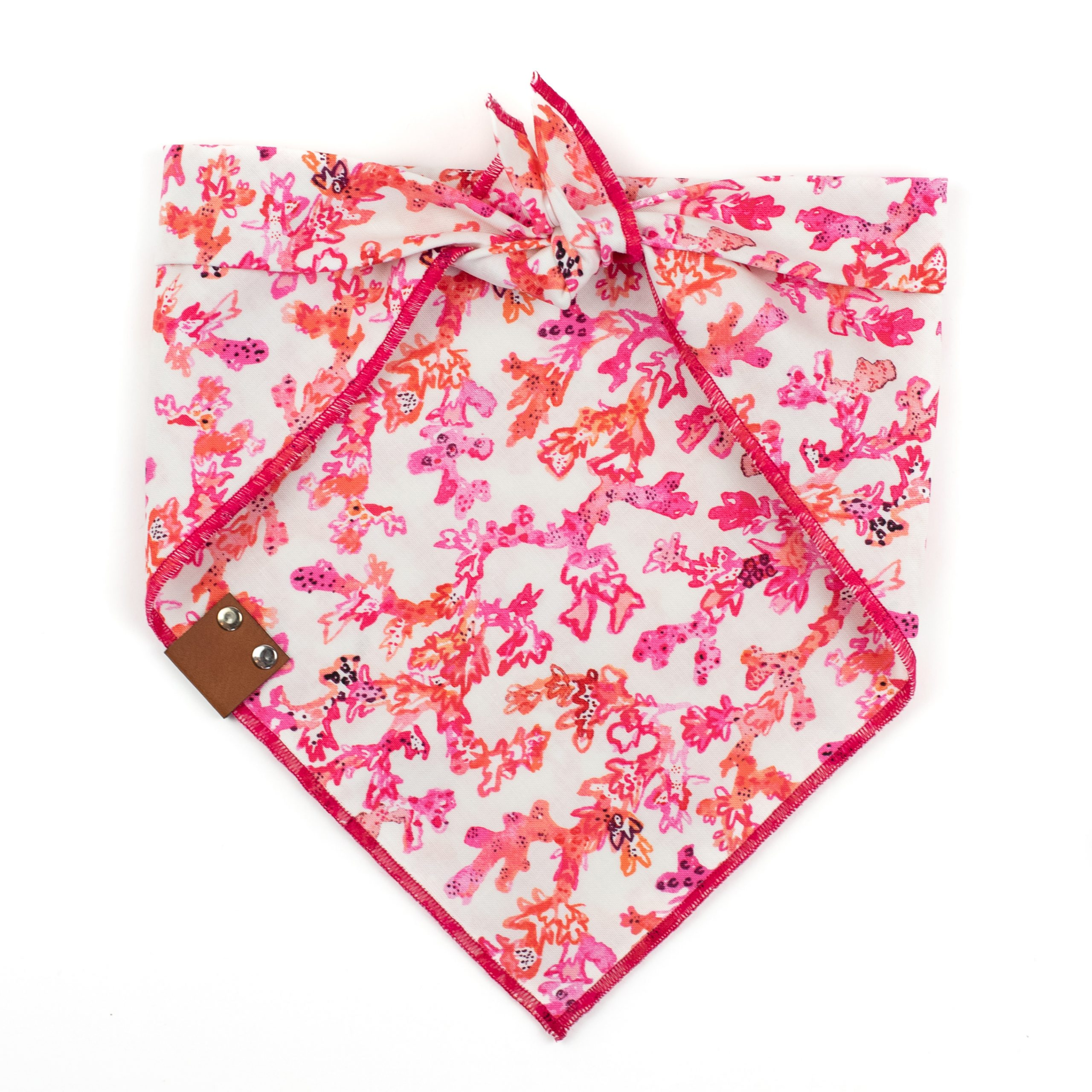 Coral Reef Dog Bandana with a pink, red and orange coral reef pattern